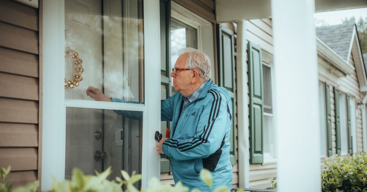 locksmith unlocking front door — Tremont Ave Locksmith Inc